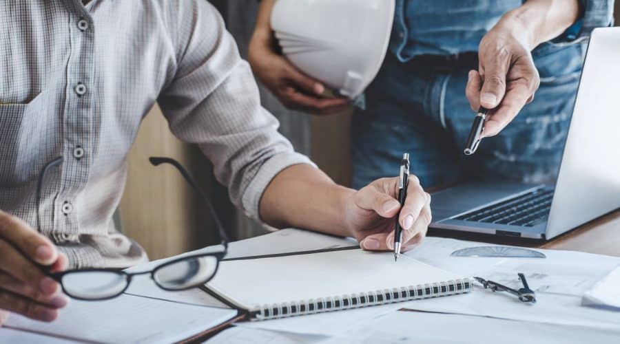 2 people checking property documents